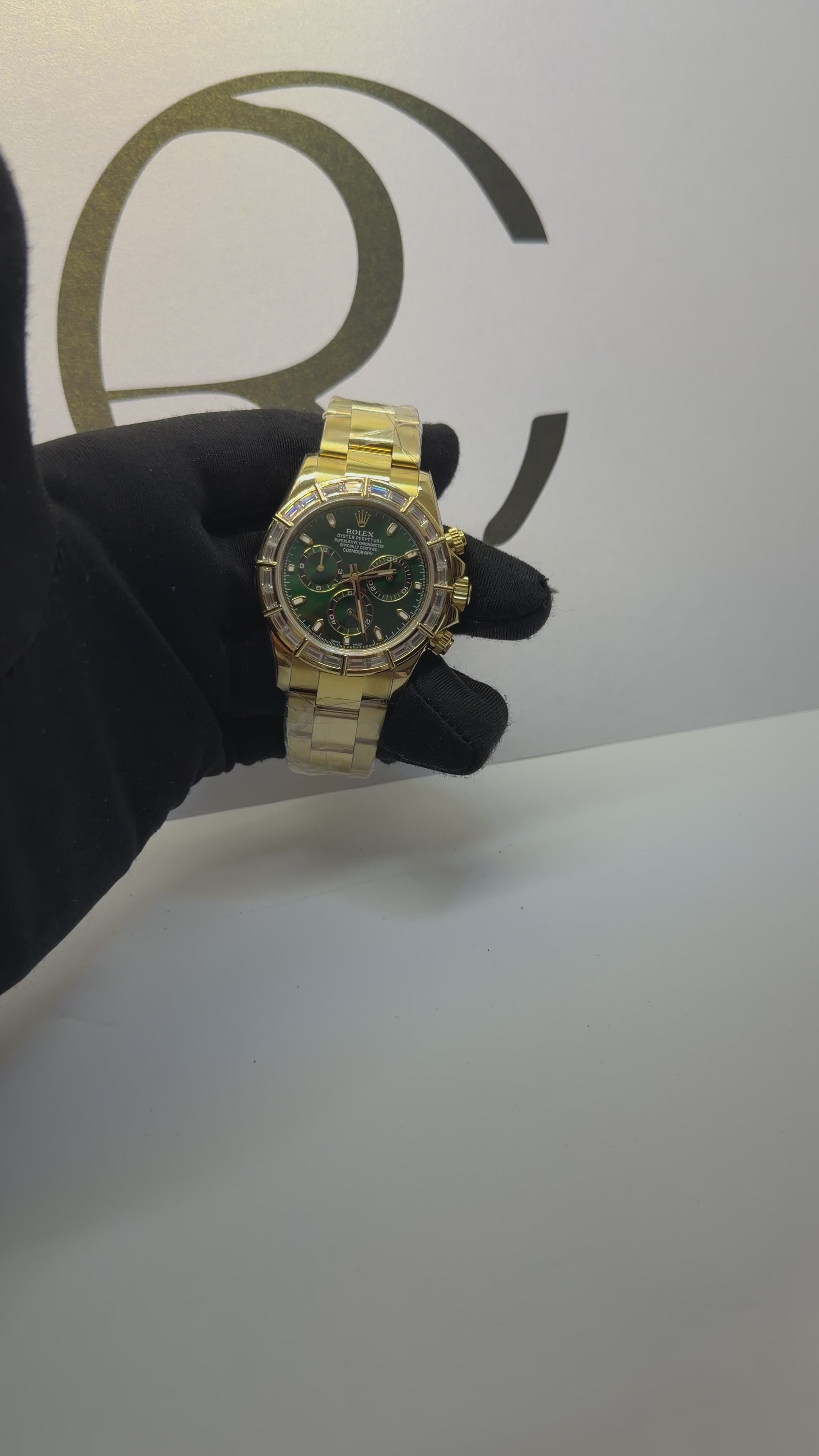 Rolex Cosmograph Daytona 116568BR 40mm Green Dial Baguette Diamond Bezel Oyster Yellow Gold Watch
